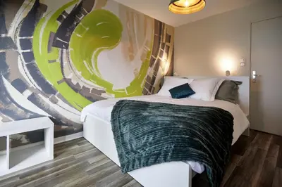 Un ou plusieurs lits dans un hébergement de l'établissement Maison 140m2 au calme - Beau jardin - à 15mn à pied du Centre-ville de COLMAR