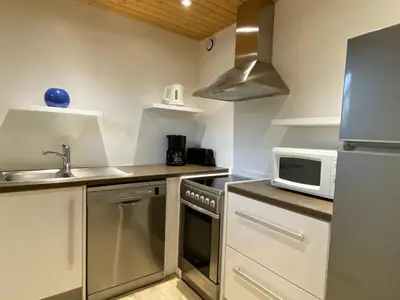 Cuisine ou kitchenette dans l'établissement Chalet Miel