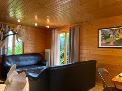 Coin salon dans l'établissement Chalet Miel