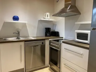 Cuisine ou kitchenette dans l'établissement Chalet Miel