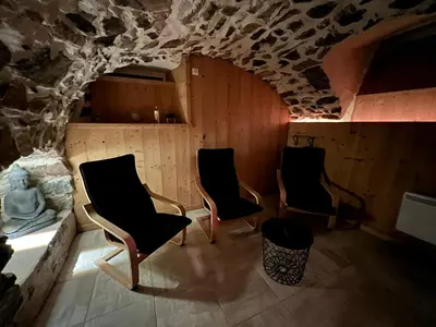 Coin salon dans l'établissement Gîte Au Creux Du Moulin