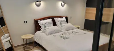Un ou plusieurs lits dans un hébergement de l'établissement Charmant appartement 3* au cœur des Vosges (PMR)