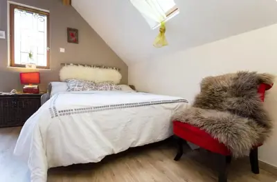 Un ou plusieurs lits dans un hébergement de l'établissement Gîte La Bergerie Chalet indépendant