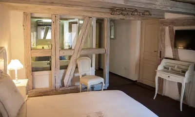 Un ou plusieurs lits dans un hébergement de l'établissement Chambre Le Hupsa Pfannala