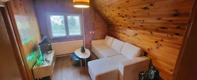 Coin salon dans l'établissement Appart Bois de reve SPA