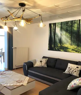 Coin salon dans l'établissement Gite des Hauts Jardins