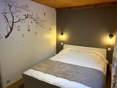 Un ou plusieurs lits dans un hébergement de l'établissement Joli Duplex sur la rive du lac