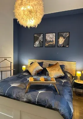 Un ou plusieurs lits dans un hébergement de l'établissement Charmant Cottage de village