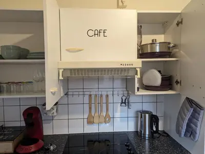 Cuisine ou kitchenette dans l'établissement Le Bâlois - appartement 2 chambres, salon, cuisine équipée, parking et wifi gratuit