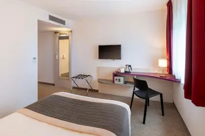 Télévision ou salle de divertissement dans l'établissement Best Western Colmar Expo
