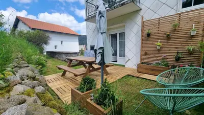 Jardin de l'établissement F2* * * 80M DU LAC avec vue+terrasse+proche centre