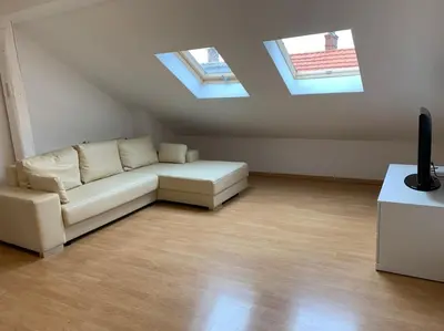 Coin salon dans l'établissement Cozy Little One Room Appartment, a tranquil haven!