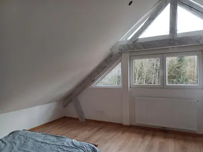 Un ou plusieurs lits dans un hébergement de l'établissement Les chambres du Haras St Georges