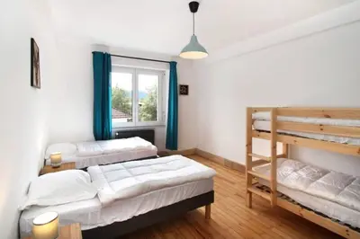 Un ou plusieurs lits dans un hébergement de l'établissement Charmant appartement en centre ville