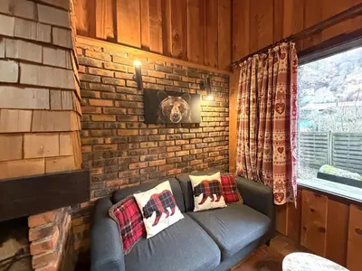 Coin salon dans l'établissement LA POMME DE PIN 1 Appartement avec terrasse