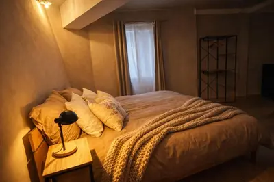 Un ou plusieurs lits dans un hébergement de l'établissement Mulhouse City Loft