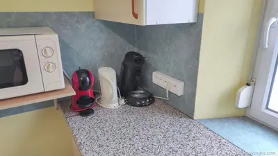 Cuisine ou kitchenette dans l'établissement PARME Appt spacieux et calme plein sud, vue panoramique