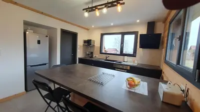 Cuisine ou kitchenette dans l'établissement CHALET L'ÉCHAPPÉE NATURE 4 étoiles sauna