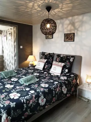Un ou plusieurs lits dans un hébergement de l'établissement Happiness Cottage