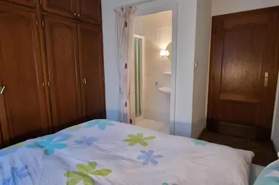 Un ou plusieurs lits dans un hébergement de l'établissement Steps from Basel and Train Spacious 120 m2 Apartment in Saint Louis with Terrace and Garden