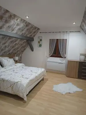 Un ou plusieurs lits dans un hébergement de l'établissement Gîte Chez l'Oncle Paul