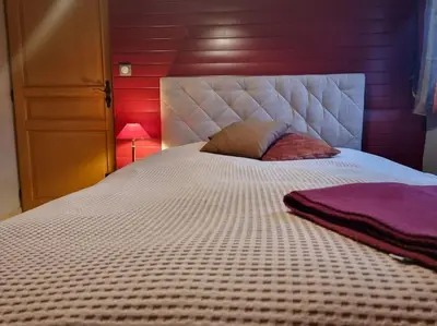 Un ou plusieurs lits dans un hébergement de l'établissement La Maison Chamarrée