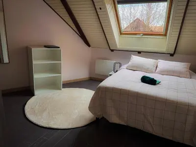Un ou plusieurs lits dans un hébergement de l'établissement Spacieux Appartement 3 chambres Cosy