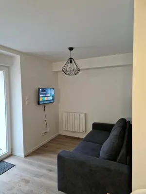 Télévision ou salle de divertissement dans l'établissement Appartement au pied des pistes avec grande terrasse