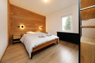 Un ou plusieurs lits dans un hébergement de l'établissement L'Echappée - Gîte chalet rénové, terrasse, jardin