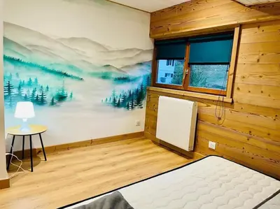 Un ou plusieurs lits dans un hébergement de l'établissement Appartement La Galerie de Mémé