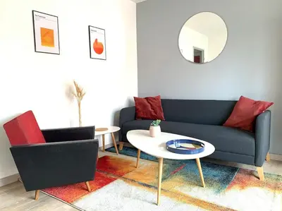 Coin salon dans l'établissement Appartement tout équipé proche General Electric