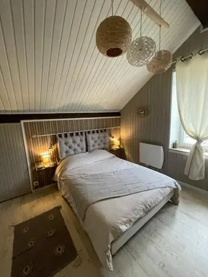 Un ou plusieurs lits dans un hébergement de l'établissement L appartement chez J&C
