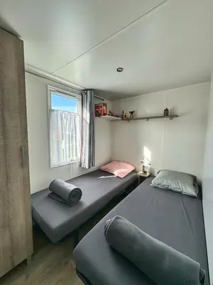 Un ou plusieurs lits dans un hébergement de l'établissement Grand Mobile-Home 6 Places climatisé