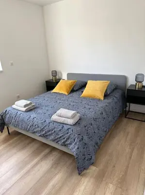 Un ou plusieurs lits dans un hébergement de l'établissement Bel appartement en plain-pied 5 min de Colmar