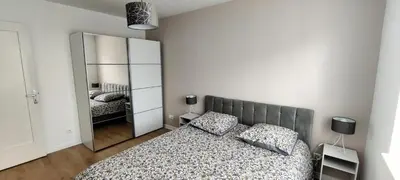 Un ou plusieurs lits dans un hébergement de l'établissement Agréable et Spacieux Appartement lumineux T4 ALSACE