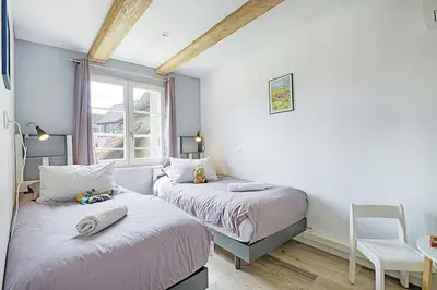 Un ou plusieurs lits dans un hébergement de l'établissement BREDALA**** Gîte maison Alsacienne avec Jardin