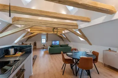 Coin salon dans l'établissement Le 1552 - Gîte de charme - Parking Gratuit