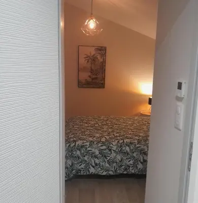 Un ou plusieurs lits dans un hébergement de l'établissement Apartment calme