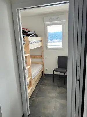 Un ou plusieurs lits dans un hébergement de l'établissement Appartement Neuf VUE LAC 6/8pers
