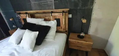 Un ou plusieurs lits dans un hébergement de l'établissement appartement standing Gérardmer jacuzzi