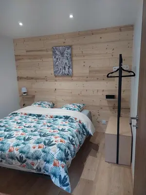 Un ou plusieurs lits dans un hébergement de l'établissement Bel appartement 6pers