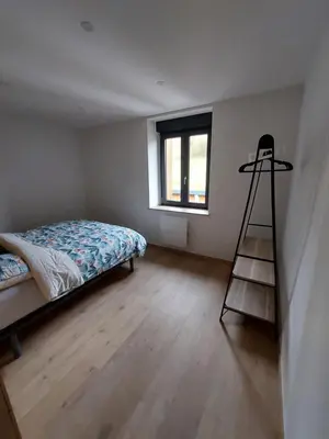 Un ou plusieurs lits dans un hébergement de l'établissement Bel appartement 6pers
