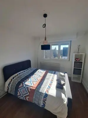 Un ou plusieurs lits dans un hébergement de l'établissement Appartement proche centre-ville, parking gratuit