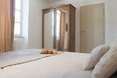 Un ou plusieurs lits dans un hébergement de l'établissement La Chambre Aux Anges