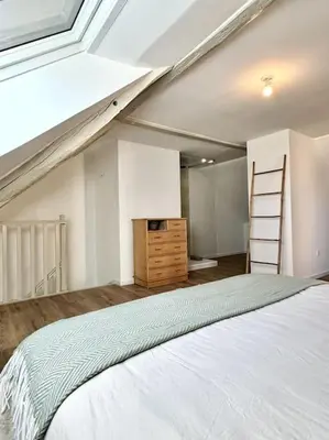 Un ou plusieurs lits dans un hébergement de l'établissement Duplex Amour Toujours
