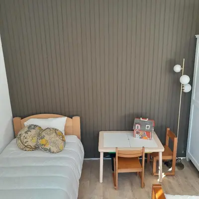 Un ou plusieurs lits dans un hébergement de l'établissement Appartement osca des brimbelles