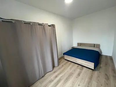 Un ou plusieurs lits dans un hébergement de l'établissement Appartement centre-ville de Lure droit