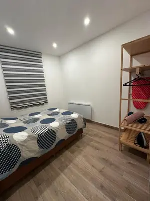 Un ou plusieurs lits dans un hébergement de l'établissement Appartement Douceur