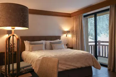 Un ou plusieurs lits dans un hébergement de l'établissement Domaine de Montagne - Hôtel Chalet Frère Joseph
