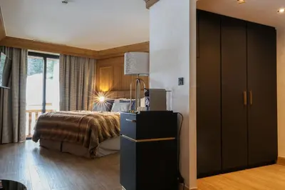 Un ou plusieurs lits dans un hébergement de l'établissement Domaine de Montagne - Hôtel Chalet Frère Joseph